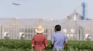 farmers observing greenhouses in BBC documentary about Corteva Agriscience