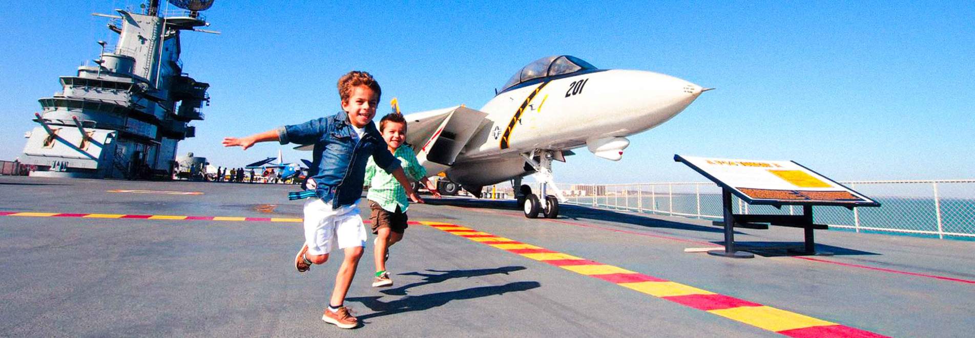 Kids running on aircraft carrier Lifestyle Photography from K2 Productions