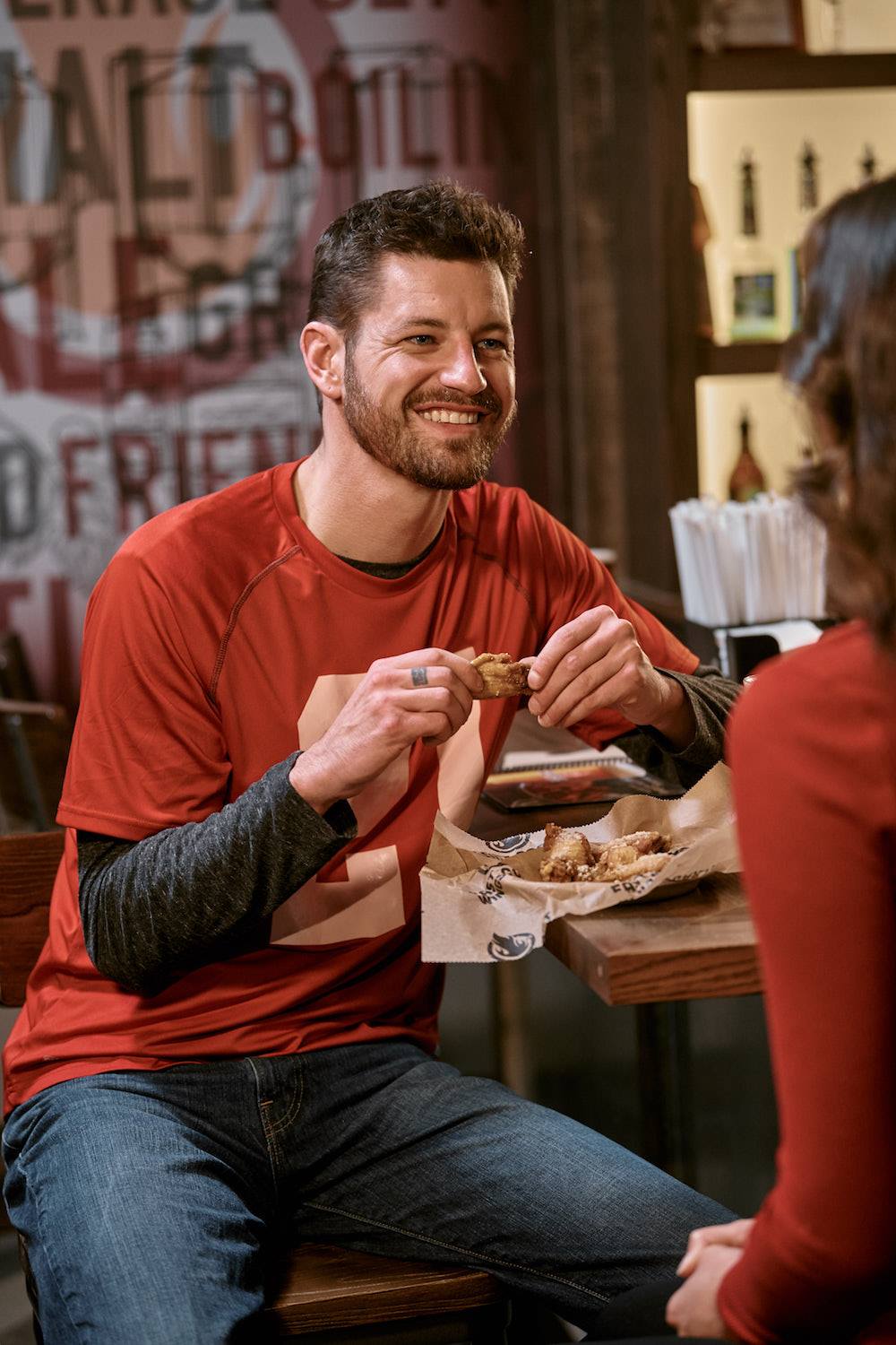 Man eating wings Lifestyle Photography from K2 Productions